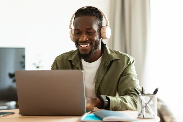 Tutor with headphones providing tutoring services for reading competency