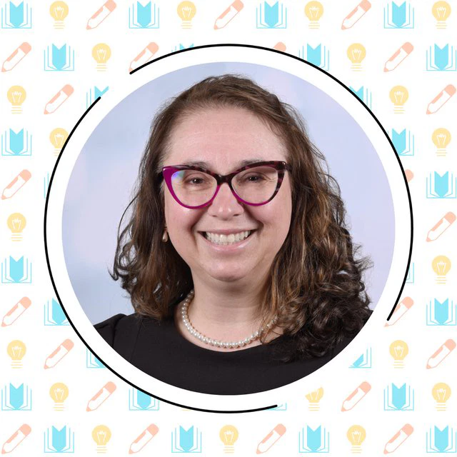 A woman with curly hair and glasses smiles at the camera. She is wearing a black top and a pearl necklace. The background features a pattern of books, lightbulbs, and pencils.
