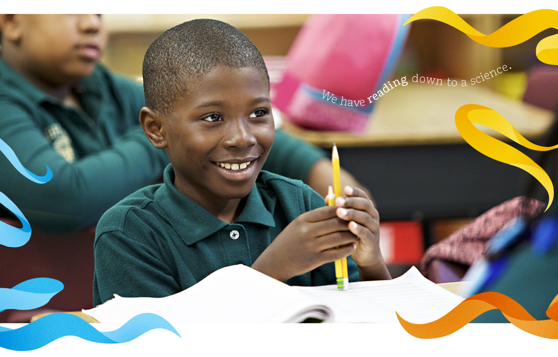 A student in a green shirt smiles while holding a pencil in a classroom. Open notebooks and colorful graphic elements are visible.