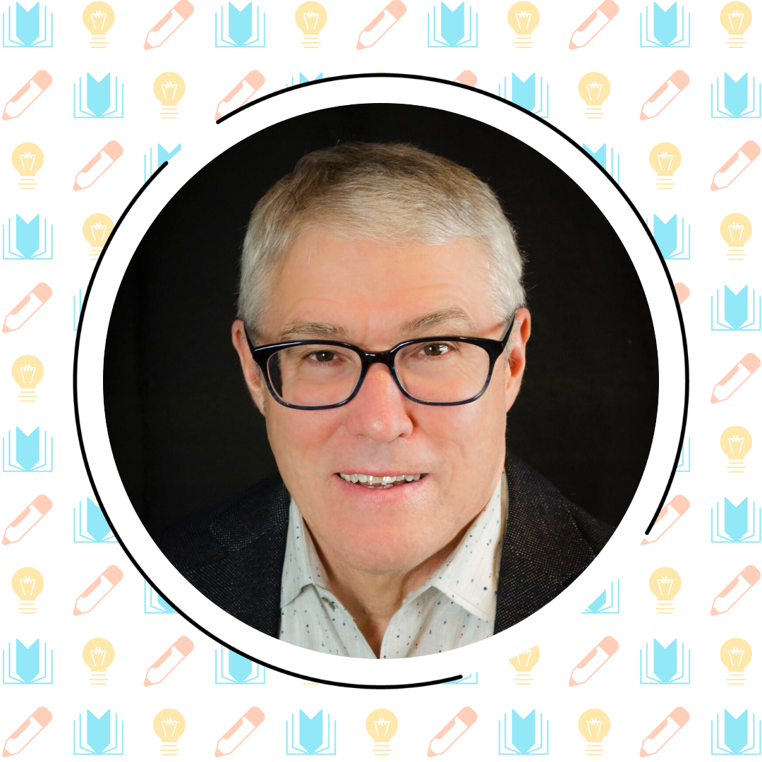 A man with short gray hair and glasses smiles at the camera. He is wearing a white patterned shirt and a dark jacket, with a background of illustrated books, pencils, and lightbulbs.
